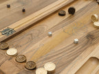 A carved bird worked into the corner of the board