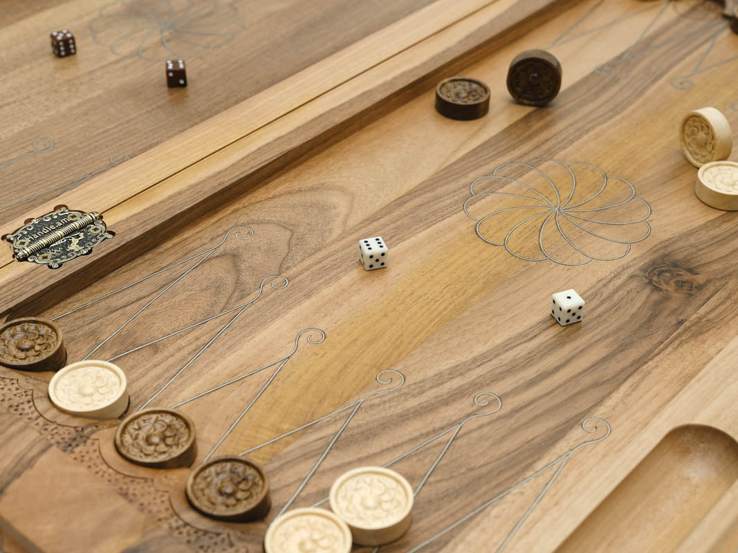 A carved bird worked into the corner of the board