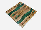 Angled view of the green epoxy chess and backgammon board