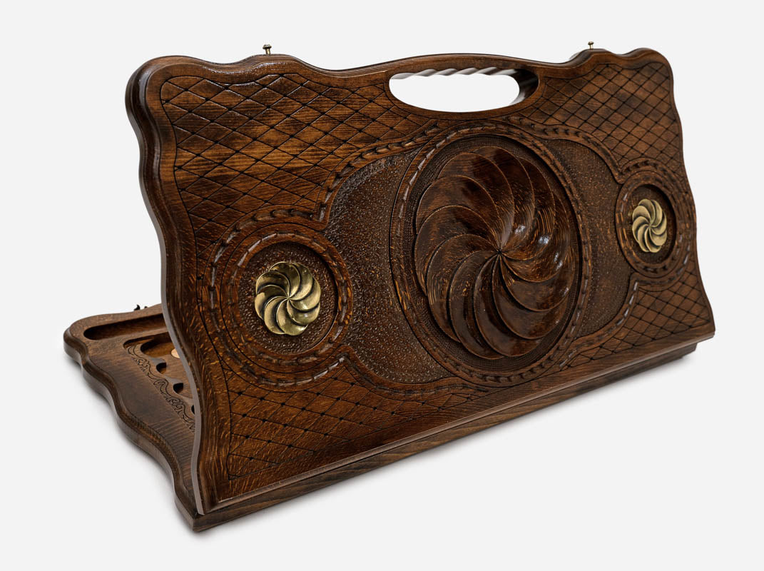 Carved beechwood backgammon board with the Armenian eternity symbol and bronze accents, propped open