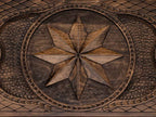 The backgammon board opened to show the wooden playing surface