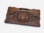 Angled view of the bronze lion carved backgammon board