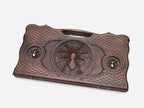 The backgammon board opened to show the wooden playing surface
