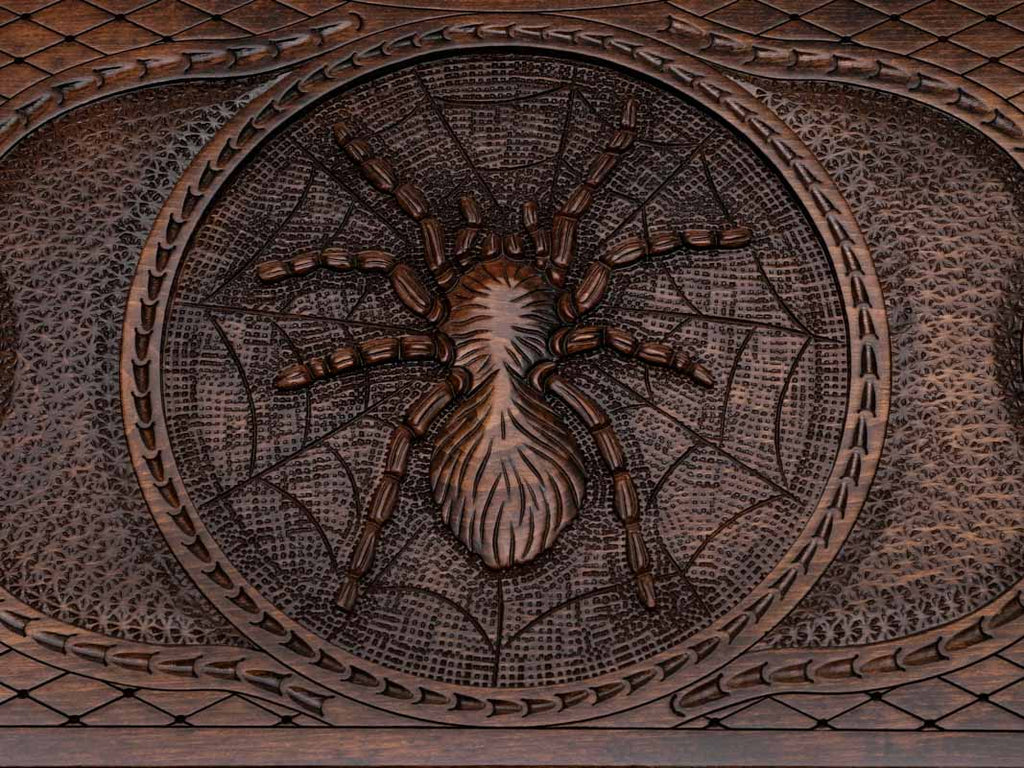 Angled view of the bronze spider carved backgammon board