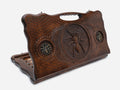 Carved beechwood backgammon board with a spider on its web and bronze details, propped open