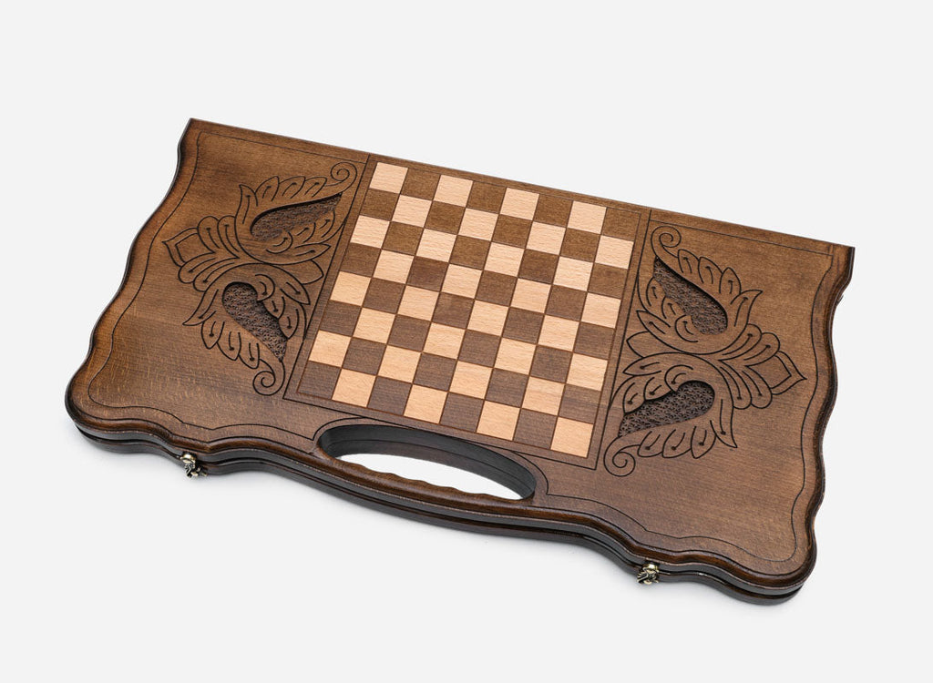 Side view of the folded board showing its bronze hinges and clasps