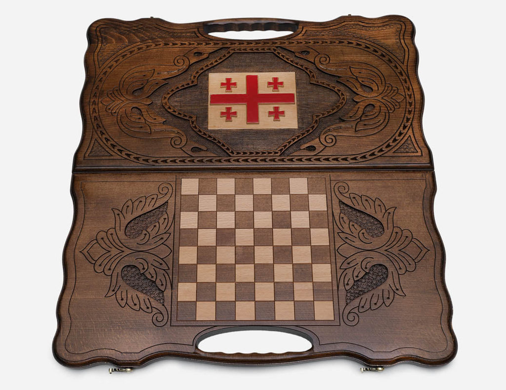 The cut-out carry handle and the upper carving of the lid