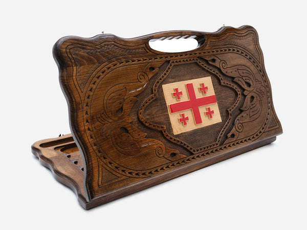Carved Georgian backgammon board with the five-cross flag and a cut-out carry handle, propped open