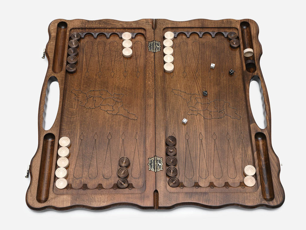 Angled view of the handmade Georgian backgammon set showing the carved lid
