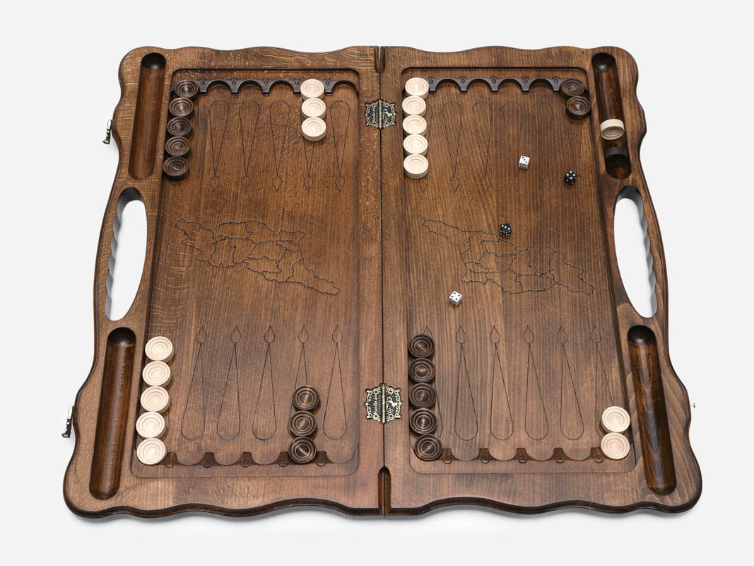 Angled view of the handmade Georgian backgammon set showing the carved lid