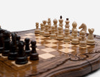 Wooden chess set with carved ornament frame