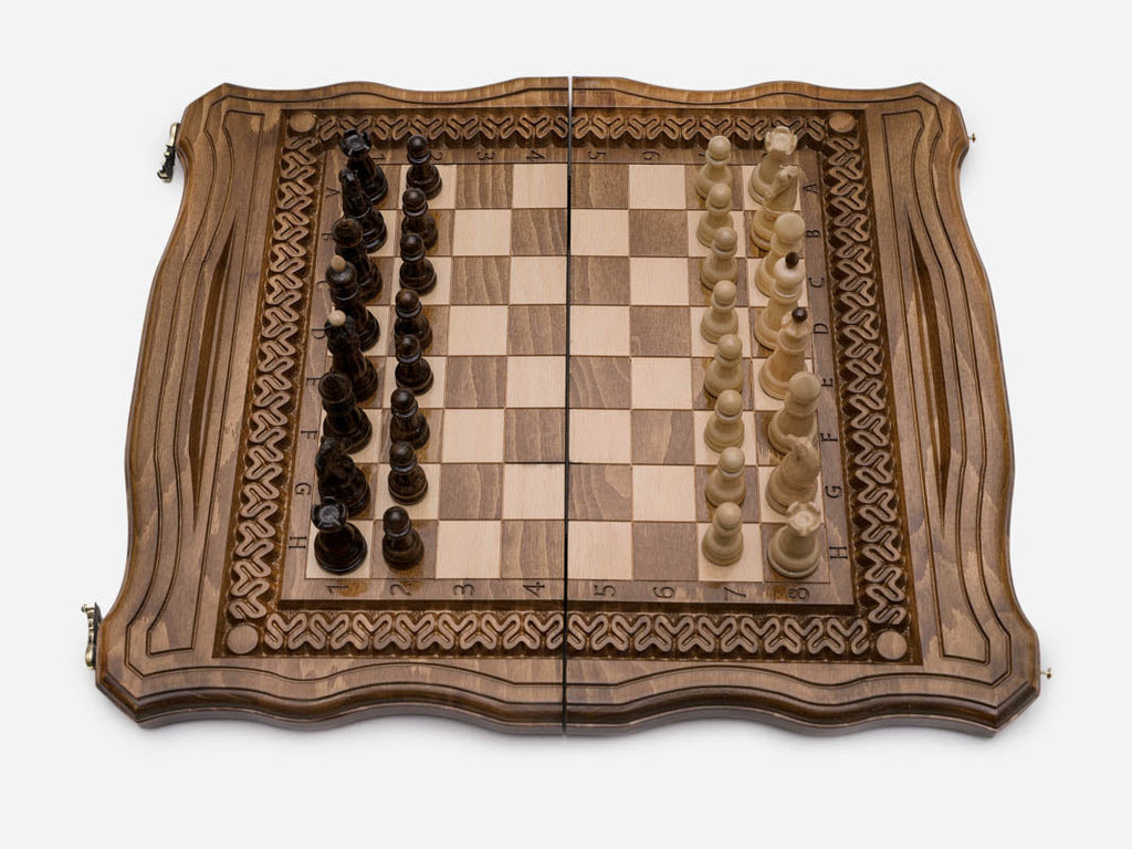Turned wooden chess pieces on the ornament board