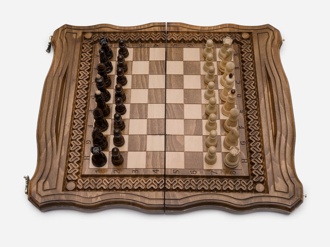 Turned wooden chess pieces on the ornament board