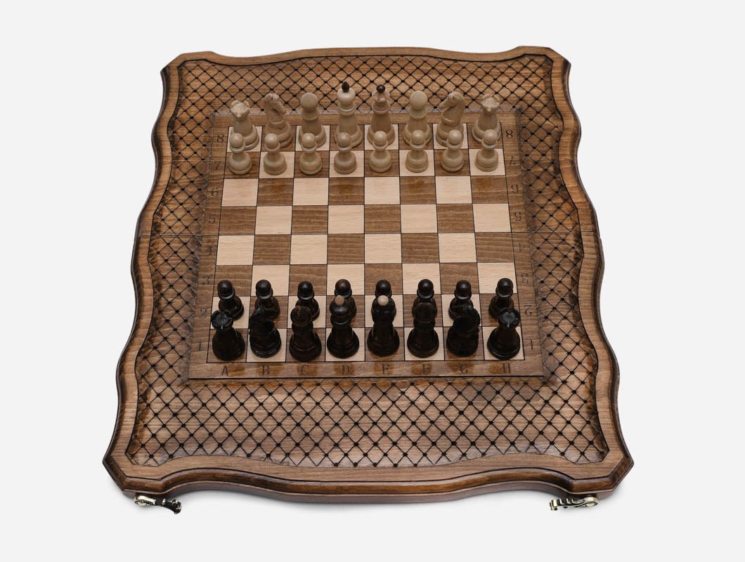 The board open flat with all 32 wooden pieces set up for a new game, seen from above