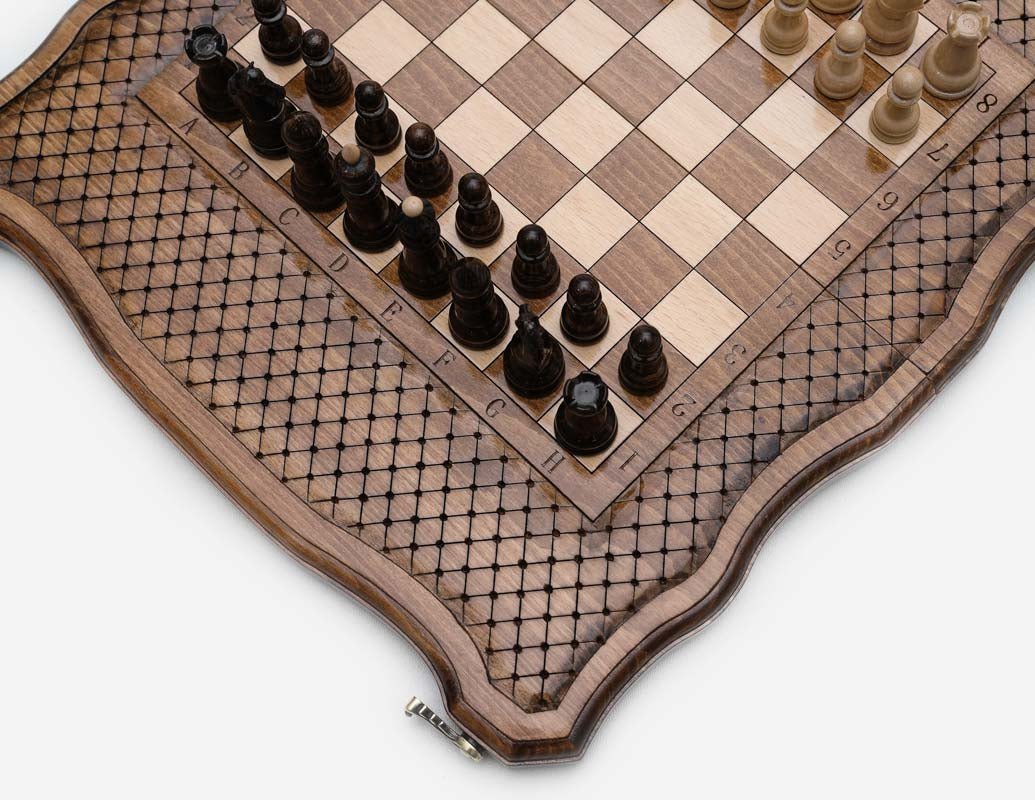 Close-up of the carved board coordinates and the dark walnut pieces
