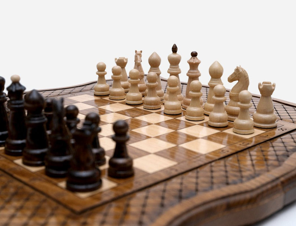 Close-up of the beech and walnut chess pieces set up on the board