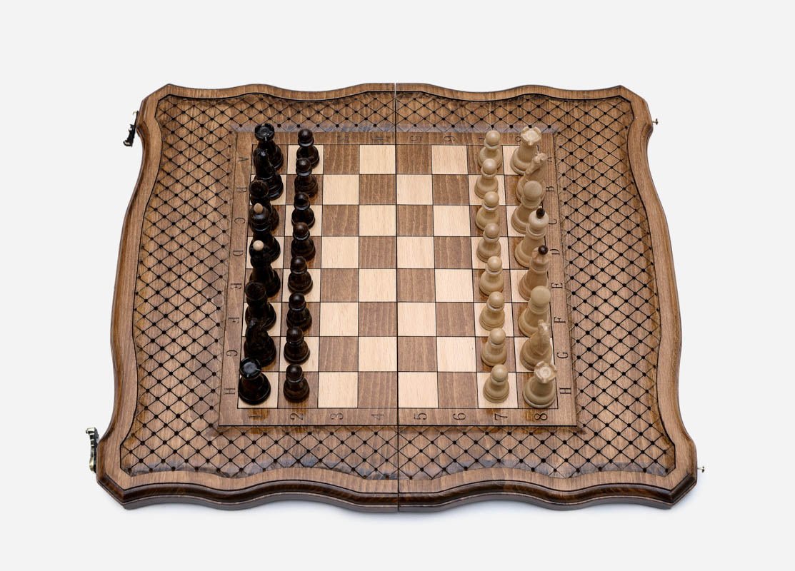The board open flat with the pieces in starting position, angled top view