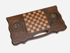 Side view of the folded board showing its bronze hinges and clasps