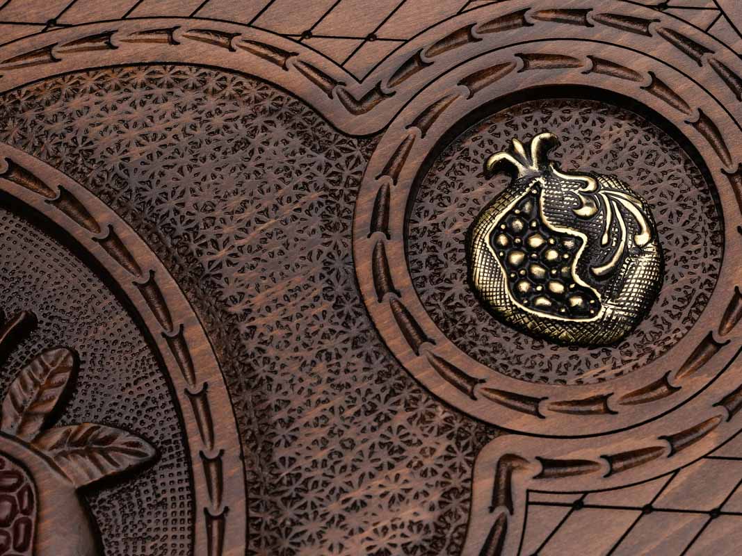 Detail of one of the two smaller bronze pomegranates