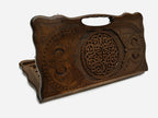 Carved Armenian backgammon board with a woven interlaced ornament and a cut-out carry handle, propped open