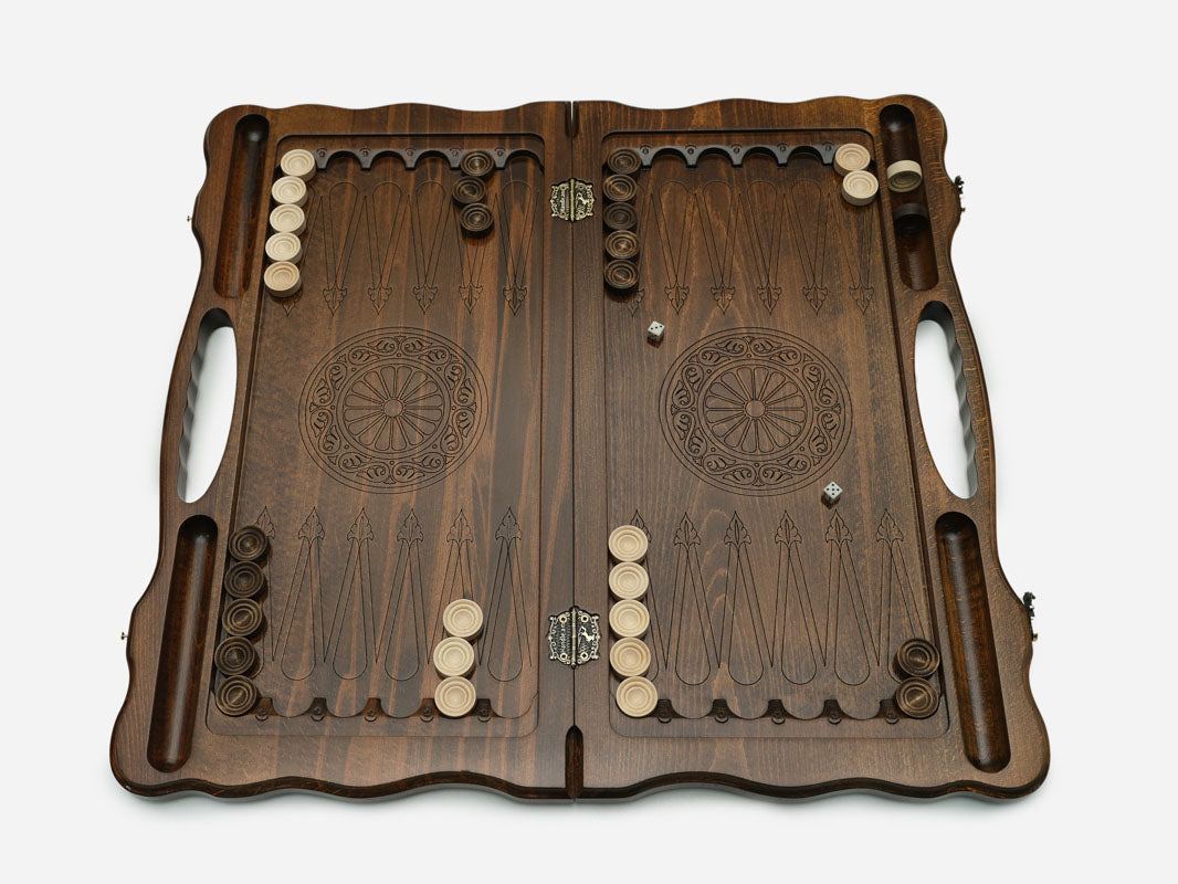 Side view of the folded board showing its bronze hinges and clasps