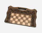The folding chess board partly closed, showing its case form and carved handle