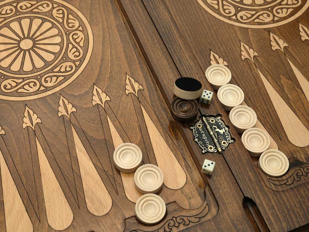 Close-up of the checkers, dice and cup on the eagle table