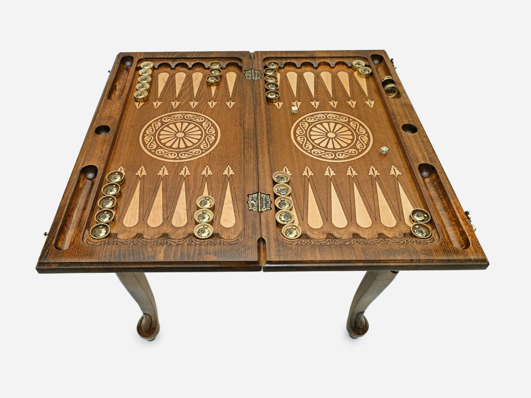 Pomegranate table opened flat for backgammon with checkers set up, top-down view