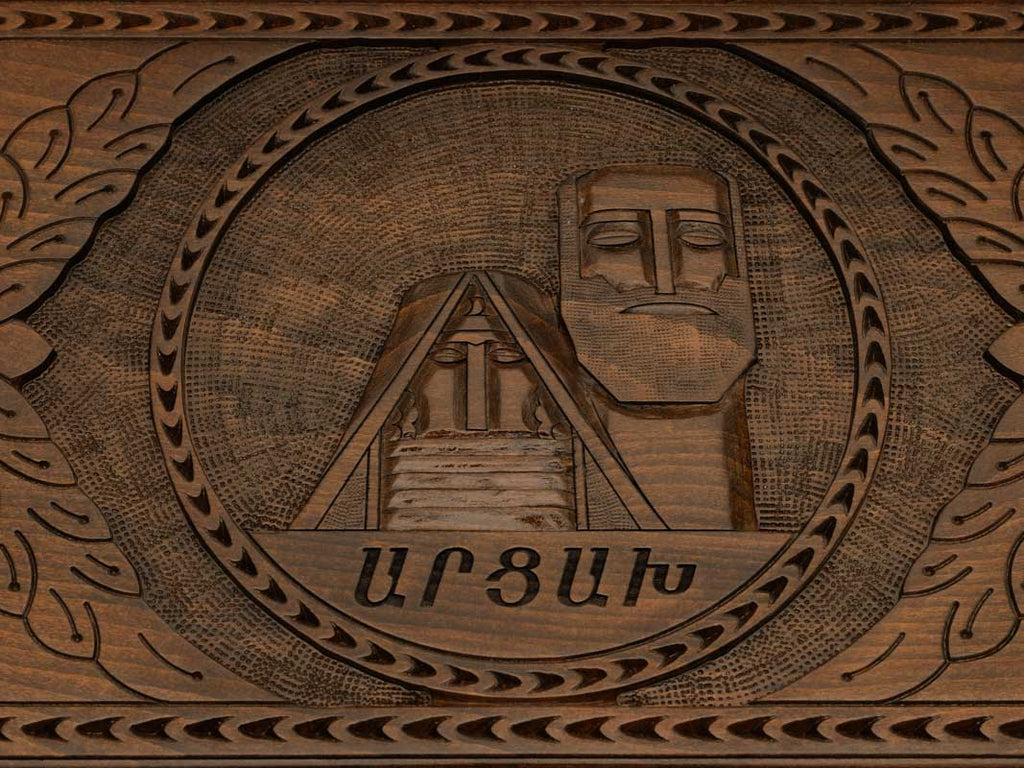 Detail of the carved scrollwork and Artsakh lettered in Armenian script