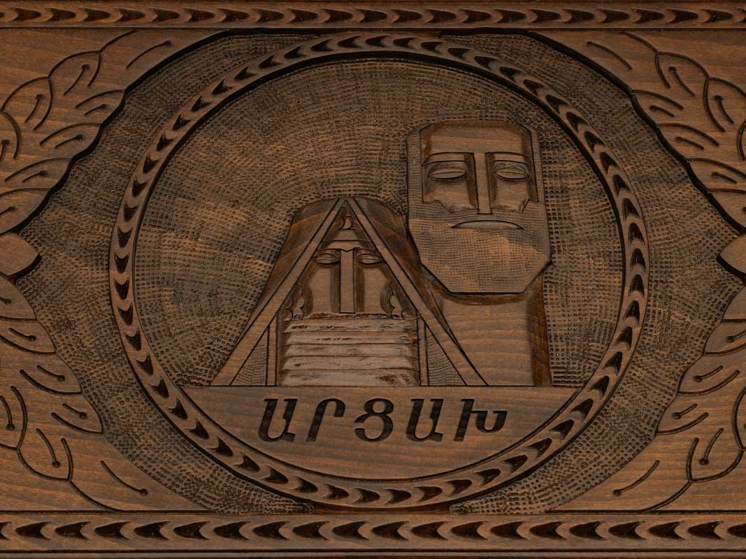 Detail of the carved scrollwork and Artsakh lettered in Armenian script