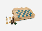 Luxury blue epoxy travel chess set in pale wood with turned wooden pieces, shown partly open