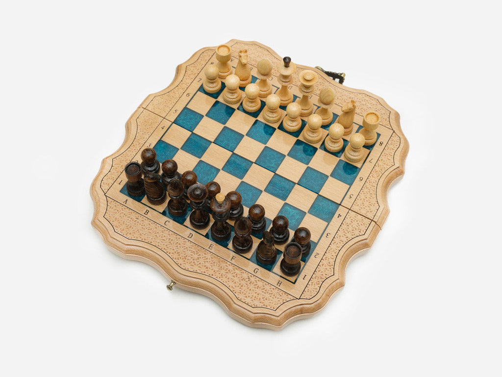 Angled view of the folding blue epoxy chess set open for play