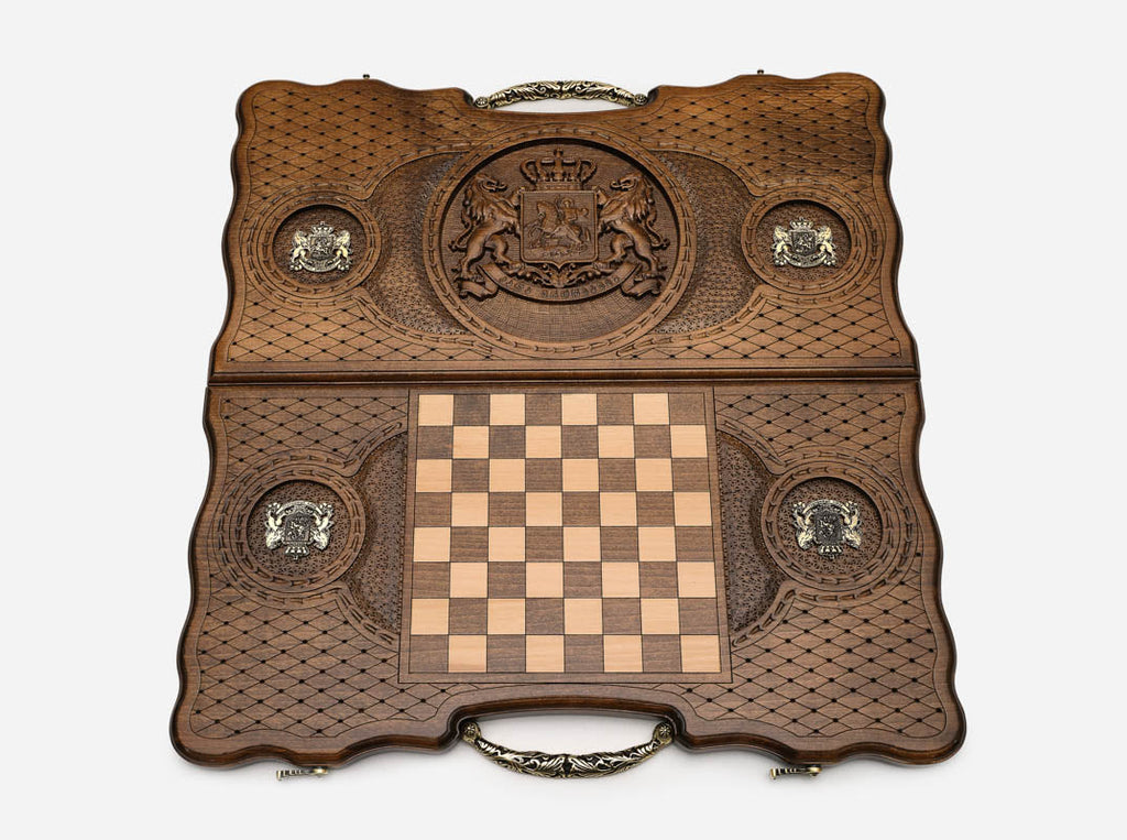 The ornate cast bronze carry handle fitted to the board