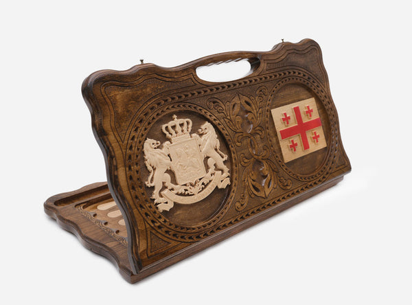 Carved Georgian backgammon board with the coat of arms and the five-cross flag, cut-out carry handle, propped open