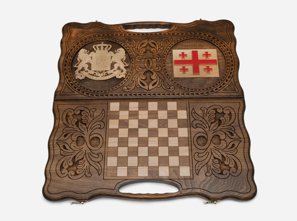 Angled view of the handmade Georgian backgammon set showing both emblems on the lid