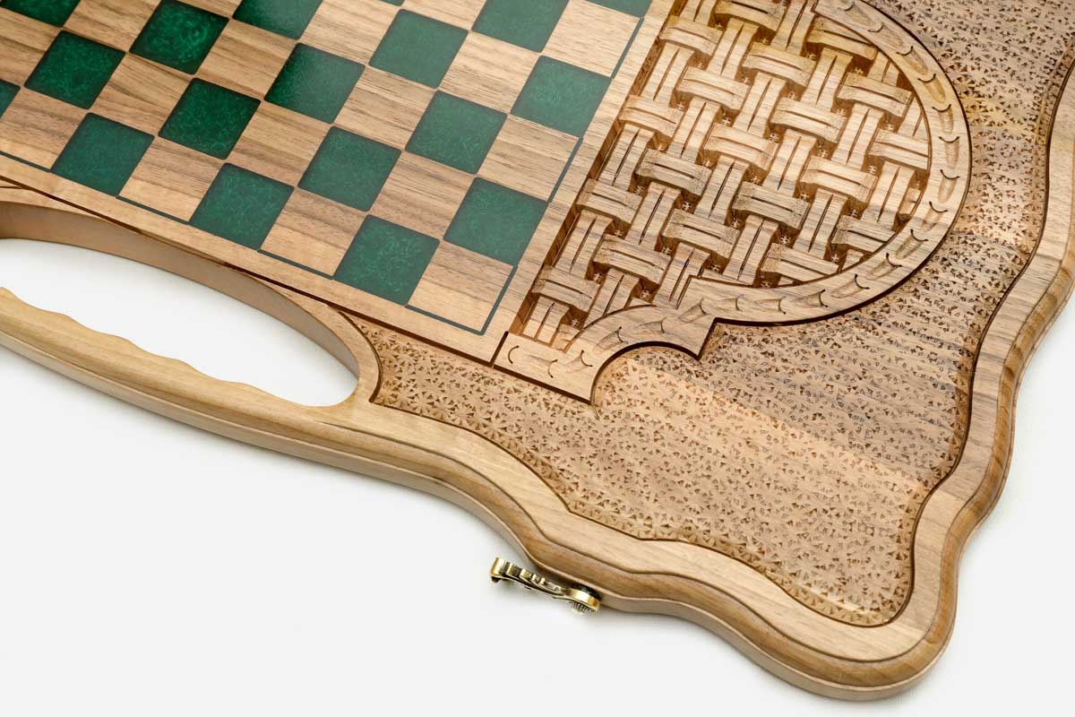 The open backgammon layout with wooden checkers
