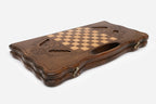 Side view of the folded board showing its bronze hinges and clasps