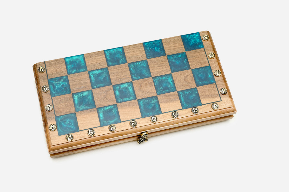 Top-down view of the glossy turquoise squares against the walnut light squares