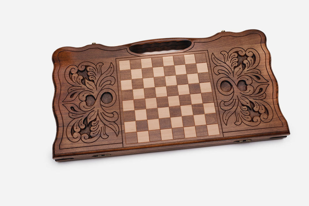Side view of the folded board showing its bronze hinges and clasps