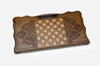 Side view of the folded board showing its bronze hinges and clasps