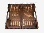 Side view of the folded board showing its bronze hinges and clasps