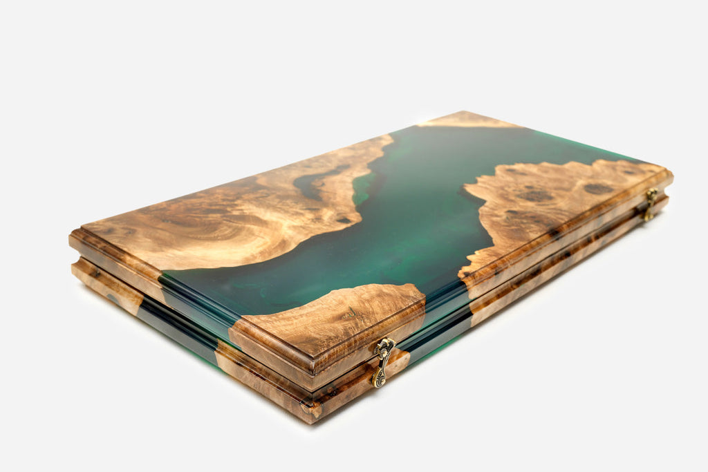 Detail of the glossy green epoxy surface and natural wood grain