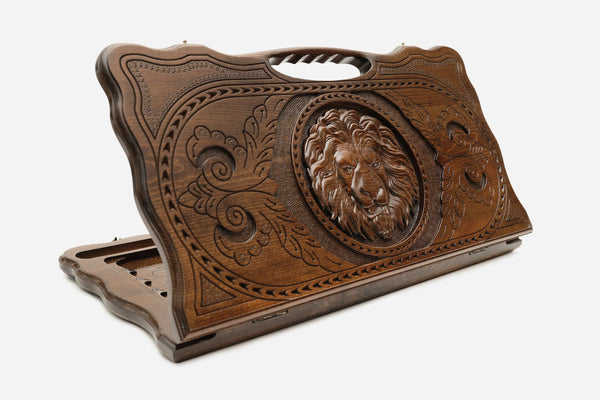 Beechwood backgammon board carved with a lion's head and floral scrollwork