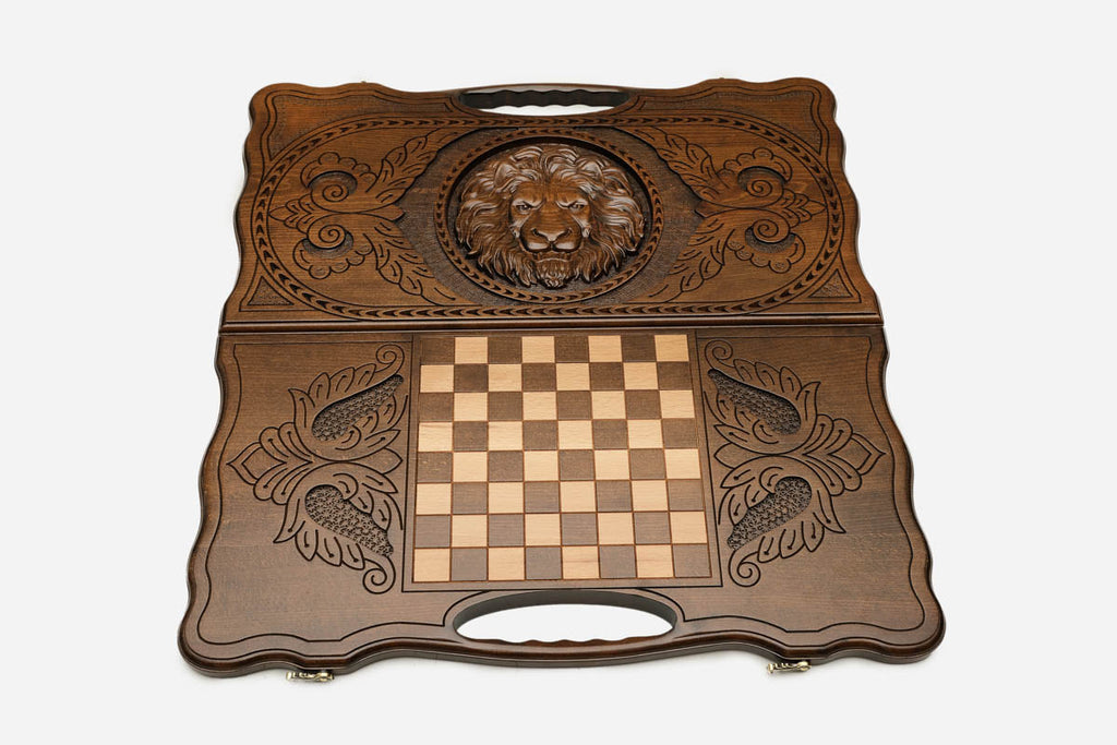 Floral scrollwork detail on the lion backgammon board