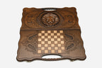 Floral scrollwork detail on the lion backgammon board