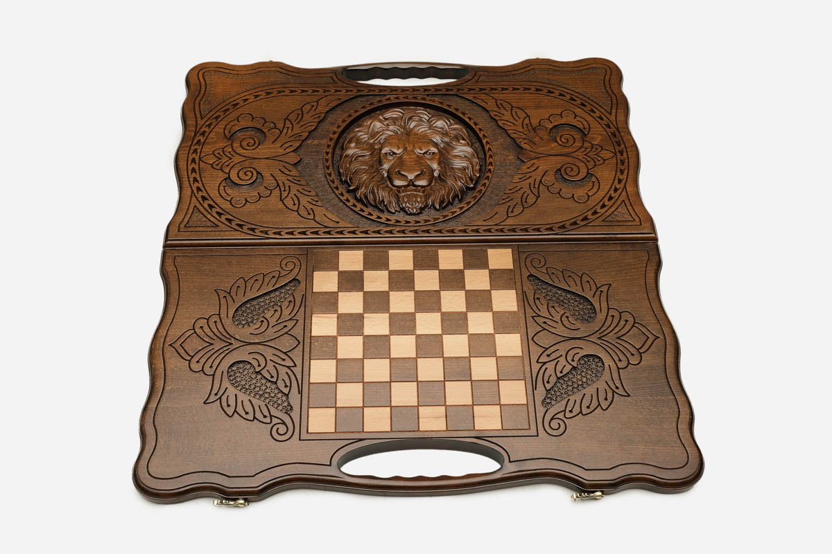 Floral scrollwork detail on the lion backgammon board