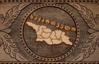 Detail of the carved scrollwork framing the map