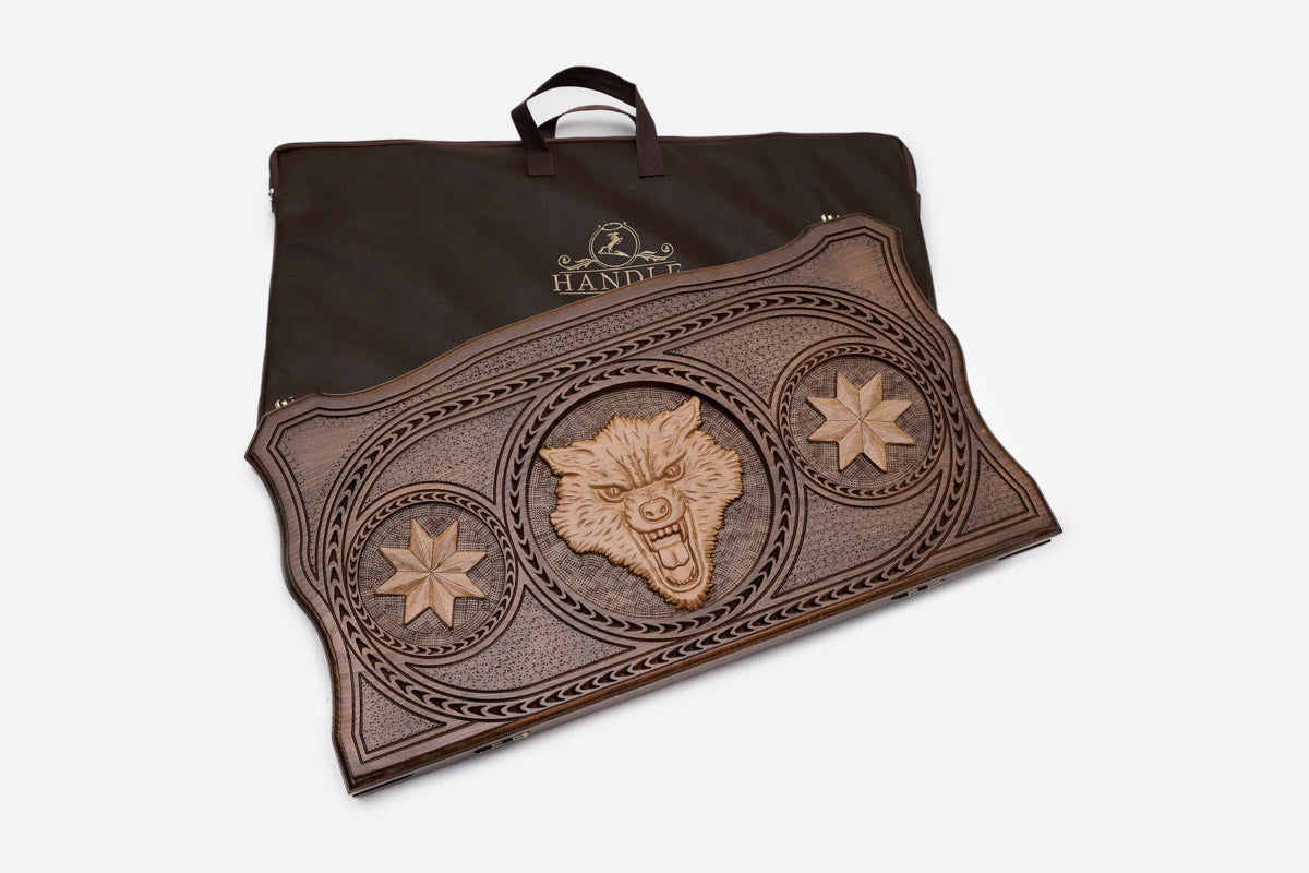 Wolf among octagon symbols hand-carved in wood - backgammon board detail
