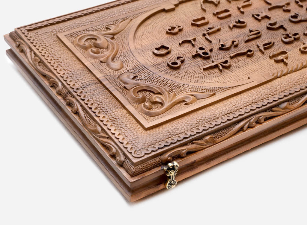 Side view of the folded walnut board showing its bronze hinges