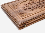 Side view of the folded walnut board showing its bronze hinges